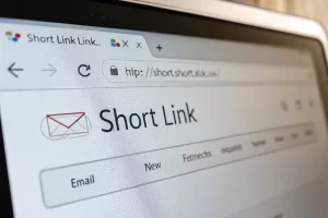 Close-up of a digital screen displaying a branded short URL link in a minimalistic email interface, enhanced by soft, diffused glow lighting to convey professionalism.