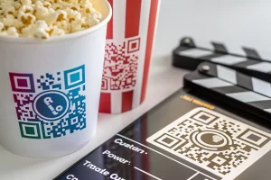 Stylized QR code with vibrant colors and a centered logo, set against a sleek modern background, showcasing distinct patterns and sharp details in a dynamic arrangement.