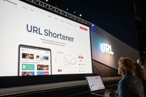 A large digital screen displaying a modern URL shortener tool interface, showcasing a branded short link generation with analytics and tracking features, emphasizing advanced technology and innovation.