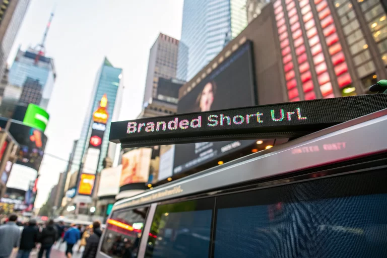 A digital advertisement screen in a busy city shows a clear, high-resolution branded short URL link. The background is blurred to emphasize the link, while the colors are bright and vivid, conveying a sense of trust and sophistication.