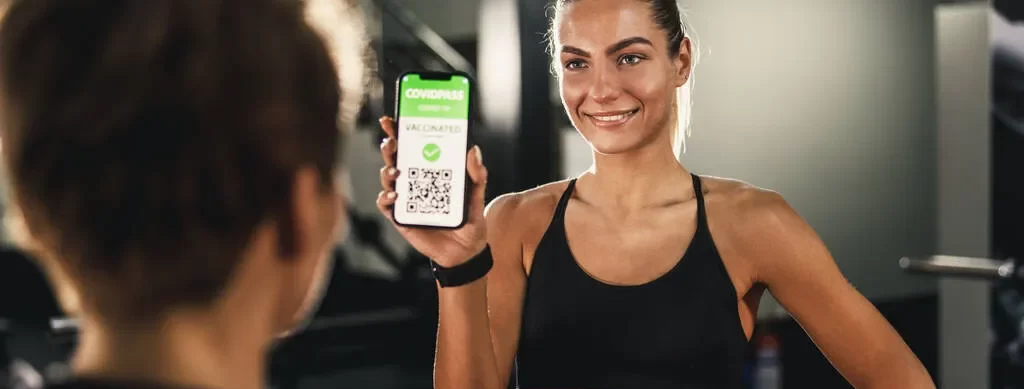 stock-photo-muscular-young-woman-enters-gym